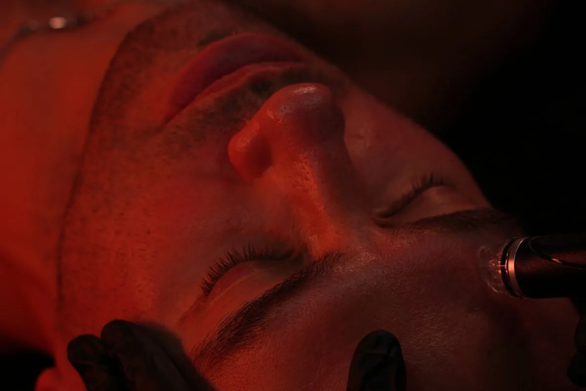 Close-up of a man receiving a Hydrafacial treatment at a spa in New York, NY
